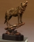Bronze Finish Wolf On A Rock Sculpture